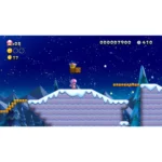 Pink-hatted character on a snowy platform in a Mario-style side-scroller, with coins nearby and a crowned brick block above under a starry night sky.