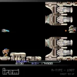 Blaze_EvercadeIREMR-TypeRGB - Video Game Depot Side-scrolling retro space shooter: player ship at bottom-left fires blue projectile at armored enemy crafts on the right amid large pixelated machines and black background.