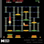 DataEast_ARCADE1_1500x15003_7e8f17d6-47ac-4bf1-b156-a7e32c9dbbd2 - Video Game Depot Screenshot of the arcade game Burger Time (1982): chef character navigating multi-tier platforms with ladders and burger ingredients on the shelves.
