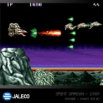 Side-scrolling shoot 'em up scene: a dragon-like enemy fires orange flame shots toward the right against a dark sky and purple horizon, with rocky foreground below.