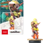 A Frye from Splatoon Amiibo figure posed on a display base, wearing a yellow top and white shorts, with the packaging artwork in the background.