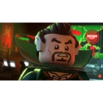 Close-up of a LEGO minifigure with a bearded face and thick eyebrows, wearing a green cape in a neon-lit arcade backdrop.