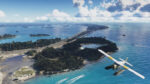 Seaplane flies over a turquoise bay toward a long bridge connecting a forested island to the mainland with a distant city skyline. Aerial view of a seaplane above clear blue water, approaching a bridge to the mainland from a green island. A small seaplane glides over a tropical island and a coastal bridge, with a distant urban skyline on the horizon. Overhead shot of a seaplane near an island, heading toward a bridge leading to a city across the water. Seaplane soaring over blue sea and islands, with a long bridge to the city in the distance.