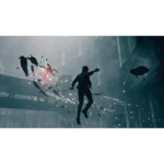 61CNY4WPBAL_SL1500___490951779470385 - Video Game Depot Man in dark clothing leaps mid-air inside an expansive industrial space as shards and sparks fly around him.