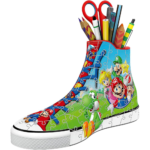 61CtDrjtgnL_AC_SL1313___858111785270348 - Video Game Depot Colorful high-top sneaker covered in puzzle pieces with Mario characters, filled with school supplies like scissors and pencils.