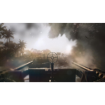 61gAFhBolQL_SL1500___443611776802439 - Video Game Depot First-person view from a tank gunner: circular sight centered, barrels extending left and right, smoke and riverbank in the distance with palm trees.