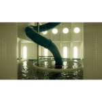 7148dQ_0L4L_SL1500___929391776280352 - Video Game Depot Indoor water park with a teal spiral slide descending into a circular pool beneath bright tiled walls.