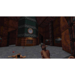 71VnojGoo3L_SL1500___800691778531465 - Video Game Depot First-person view in a dark industrial hall: the player holds a pistol, a ticket booth with a clock stands center, and a fallen body on the stone floor.