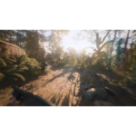 71hJs2evznL_SL1500___363481776802445 - Video Game Depot First-person view holding a rifle in a sunlit jungle, a teammate ahead on a dirt trail amid dense foliage.