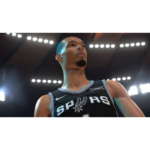 Basketball player in a San Antonio Spurs jersey looks upward under bright arena lights.