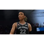 Female basketball player in a black Las Vegas jersey with number 22, standing on the court and looking to the left.