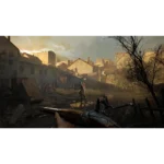 8112yBHlssL_SL1500___801071783533869 - Video Game Depot First-person shooter scene: player holds a rifle in a ruined village at sunset, enemies in the distance near dilapidated buildings in mud and debris.