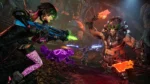 81cNwWNET5L_SL1500___263121754054253 - Video Game Depot Female gamer in futuristic armor fires a blue rifle at a muscular foe in a sci‑fi battle scene.