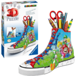81eYyMxFV0L_AC_SL1417___283651785270359 - Video Game Depot Colorful high-top sneaker covered in Mario-themed puzzle graphics shown next to a matching 3D Puzzle box on the left side