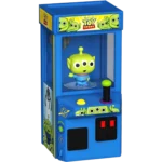 Blue Toy Story-themed arcade claw machine with a green three-eyed alien figure inside the claw area and a black joystick on the control panel.