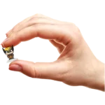 Tiny Batman figurine being held between thumb and index finger on a plain background