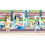 Orange dog with a camera stands near a colorful fountain as two other dogs run and watch in a sunny park scene.