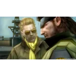 Two men stand close together on a shipyard dock, one wearing sunglasses and a yellow scarf, gazing at the other.