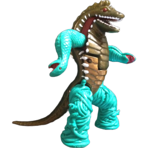 Plastic dragon action figure with turquoise rope decorations wrapped around its neck and body, open jaws showing teeth.