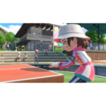 Nintendo_Switch_Sports_Resort_Screen_2__287181781039454 - Video Game Depot Female player in a pink outfit and white bucket hat prepares to serve a ping-pong ball at an outdoor table tennis court, with spectators on the steps behind.