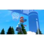 Nintendo_Switch_Sports_Resort_Screen_9__228041781039454 - Video Game Depot Animated girl with blue hairband leaps toward a basketball hoop on an outdoor court under a clear blue sky dip-dunking a ball, wearing a bright blue outfit.