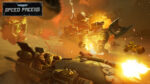Warhammer_PS5_Screen_07__332961777584813 - Video Game Depot Speed Freeks battle scene: orc driver in a turreted vehicle firing as explosions erupt around armored machines in a fiery desert