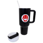 Black insulated travel mug with a handle and white straw, featuring a red dragon logo on a white circle; white spill-proof lid sits nearby.