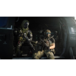 Four armed soldiers in tactical gear disembark from a military helicopter through its open rear ramp.