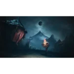 Small creature with a glowing flame on its head stands in a moonlit, ruined village with jagged mountains in the background in darkness.