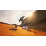71TQNlpsR-L_SL1500___210451785866761 - Video Game Depot Desert scene with orange dunes and a crashed spaceship wedged into a rocky cliff; vehicles race across the sand at sunset.