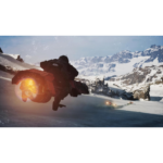 Snow-covered alpine slope with a rider in black gear launching off, orange thruster flames trailing behind him.