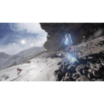 A blue futuristic vehicle climbs a snowy, rocky slope beside a dark cave in a mountainous landscape, sunlight glare nearby.