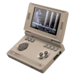 C64Image1a - Video Game Depot Open handheld C64-style gaming device displaying a pixelated platform game on its screen with a built-in keyboard-like controls