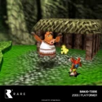 EVE-CART-RAR2-RTAIL14 - Video Game Depot Gameplay scene from Banjo-Tooie: a bear-like character faces a large orange humanoid creature outside a wooden hut in a forest clearing.