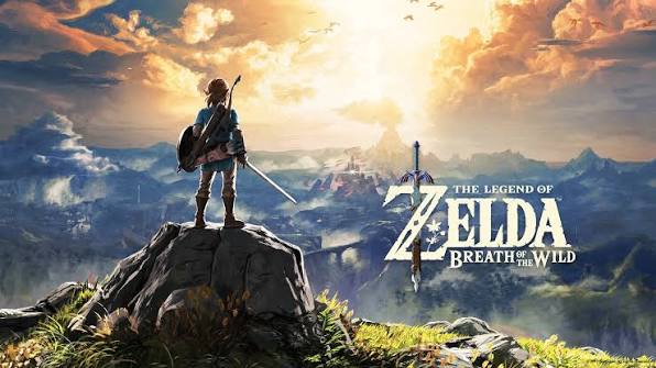 Link stands on a rock overlooking a vast valley with a sword on his back; sunset glow and distant mountains frame the scene. Title: The Legend of Zelda: Breath of the Wild.