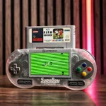 SUPABOY-PRIME-007-810007716572 - Video Game Depot Transparent handheld console with a stadium soccer game on the screen; top cartridge reads FIFA Soccer with a Sega-like logo, labeled SuperBoy Prime at the bottom left.