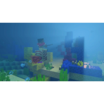 Minecraft underwater scene: a player character appears to ride a squid among colorful coral and seaweed.