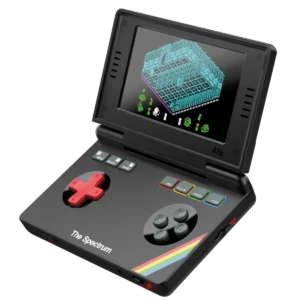 Portable retro handheld console displaying a ZX Spectrum game on its screen, with a red D-pad and color-coded buttons labeled RED, YELLOW, GREEN, CYAN, and a rainbow stripe on the bottom edge.