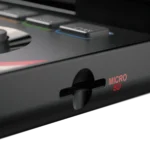 SpectrumImage6 - Video Game Depot Close-up of a black electronic device showing a microSD slot labeled 'MICRO SD' on the side