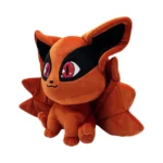 Orange plush toy animal with large ears and black eye mask, sitting on all fours.