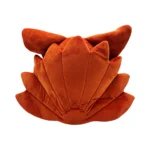 Orange plush shell-shaped pillow with petal-like folds for decorative seating or sofa decor