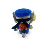 Back view of a plush raccoon-ninja toy wearing a blue cap, gray ears, black mask, red vest, and blue pants with a striped tail visible.