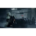 Soldier in futuristic armor crouches behind cover as combat occurs in a rainy sci-fi industrial setting, with an enemy health bar visible on a holo target.