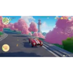 starsand-island-day-one-edition-ns2-screen-06__820361785523362 - Video Game Depot Red vintage convertible driving along a winding road through pink cherry blossom trees with a lighthouse in the distance, in-game scene.