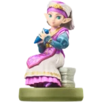 Plastic elf-princess figurine singing into a blue microphone on a green pedestal, wearing pink and teal robes.