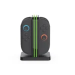 Vertical charging dock with two gray Nintendo Switch Joy-Con controllers, left with blue-ringed stick and right with orange-ringed stick.