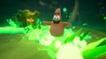 Patrick-like starfish character laughing as bright green toxic slime explodes around him in a dark cavern